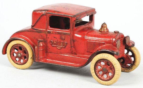 Cast Iron Arcade Fire Chief Automobile Toy.: American. Black rubber tires are original but do have some stress cracking. Marked "Arcade" on inside and "Chief" on both sides of doors. Original driver. Some paint loss to roof and trunk area. Condi