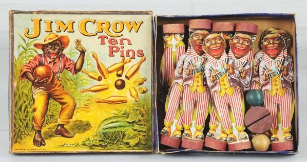 Early Lithograph Jim Crow Ten Pin Set.: Includes ten matching cardboard ten pins on wooden stands. Also comes with two wooden balls. Includes original box with nice depiction of African Americans bowling in corn field. Some creasing around 
