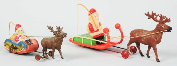 Lot of 2: Celluloid Santa Claus & Reindeer Toys.: Both are wind-ups and one is missing one hoof. Condition (Excellent). Size Largest: 11 - 1/4" L.