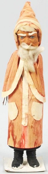 German Father Christmas Candy Container.: With cape and real wooden switches. Dressed is crepe paper with pockets, fur beard and mustache, fur bangs, paper mache head, beautiful eyes, composition boots, and snow-covered stand marked "Germany"