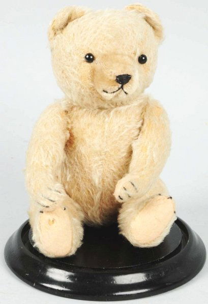 Early Straw-Filled Teddy Bear.: German. Unusual colored bear from the original owner. Very little wear overall with one small hole on the bottom pad of right foot. Also, some missing hair. Comes with vintage glass dome. Condition (E