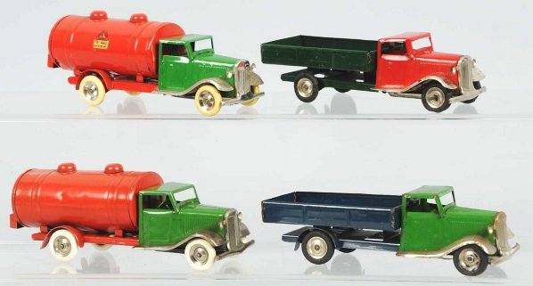 Lot of 4: Tin Wind-Up Minic Truck Toys.: English. Working. Made by Tri-Ang. Two are gasoline trucks and two are dump trucks. Gasoline trucks have replacement rubber tires. Some scratching and wear overall. Condition (Very Good). Size Largest