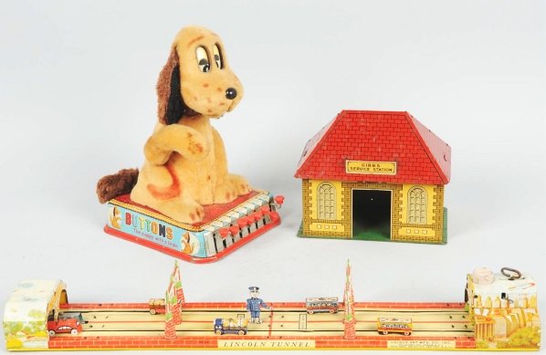 Lot of 3: Tin Wind-Up & Battery-Operated Toys.: Includes tin litho wind-up Unique Art Lincoln Tunnel toy, Gibbs Service Station missing pumps, and Japanese battery-operated Buttons the dog. Some overall wear. Condition (Very Good). Size Largest: 24
