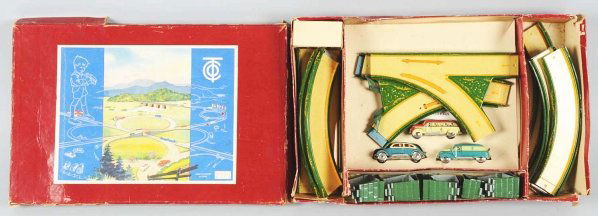Tin Litho Tippco Road Building Wind-Up Set.: German. Working. Includes instruction manual marked "No. 797" and has three lithographed vehicles including one bus, one car, and one panel van. Also includes track. Minor scratching and wear to cars
