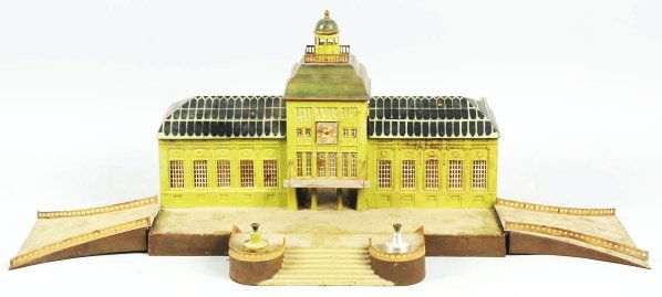 Marklin Leipzig Train Station.: German. 1-gauge. Includes original ramps, stairs, and two flower pots (one is original). The back celluloid glass is missing and someone has custom-made two wooden pieces that go on the side of the st