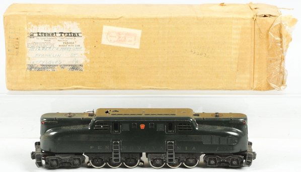 Lionel O-Gauge Pennsylvania GG-1 Train Engine.: American. Five stripe variation no. 2332. Strips are worn, especially in middle (as per usual). Original pantographs. Four-inch scratch on roof. Includes original box with insert. Condition (Very Good