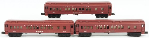 Set of 3 Lionel O-Gauge Madison Passenger Cars.: American. Includes no. 2627 Madison passenger car, no. 2625 Irvington passenger car, and no. 2628 Manhattan passenger car. Some rubbing to edges of roofs (where black is showing throughout). Includes