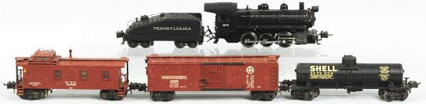Lionel O-Gauge Semi-Scale Freight Train Set.: American. Includes no. 8976 steam type switcher engine, no. 2227B slope back tender, no. 2953 shell tank car, no. 2954 boxcar, and no. 2957 New York City tender. Some of the usual zinc spotting on roo