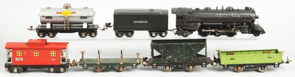 Tinplate Lionel NO. 1666 Freight Train Set.: American. O-gauge. Includes no. 1666E steam type engine with no. 2689WX tender. Includes one hopper car in a no. 655 boxcar box, no. 651 lumber car missing its load, no. 657 caboose, no. 652 X gondola