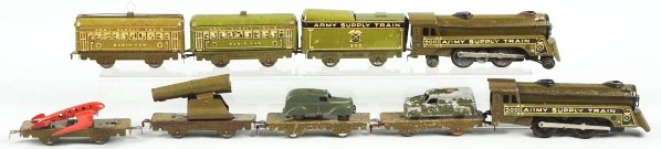 Tin Litho Marx Army Supply Train.: American. Includes two no. 500 electric style engines with matching 500 tender and six cars. Cars include two radio cars, one gun car, and three flat cars. Some scratching and wear overall. Condition 