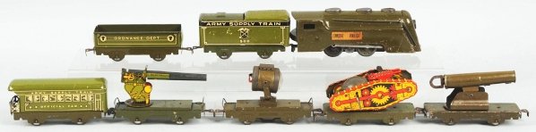 Tin Litho Marx Army Supply Train.: American. Includes a Commodore Vanderbilt engine with matching Army Supply 500 tender, and six cars. Cars include two gun cars, one searchlight car, one flat car with wind-up tank, one Ordinance Depar