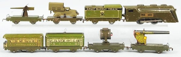 Tinplate Marx Army Supply Train.: Includes Commodore Vanderbilt engine, no. 500 tender, and six cars. Cars include two gun cars, searchlight car, radio car, and Official car caboose. One car has a restored small stack truck on it. Als