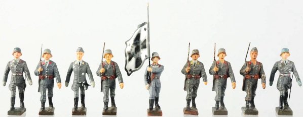 Lineol 7.5cm Luftwaffe Marching Group.: Nine pieces including flagbearer and officer. Some paint wear. Condition (Good).