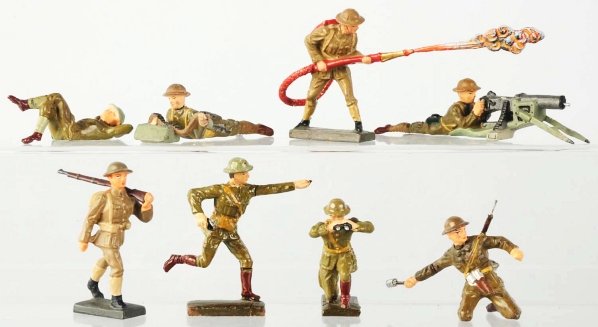 Lot of 8: Lineol US Army Soldiers.: Flame thrower, machine gunner, etc. Soldier with rifle over shoulder is possibly a re-cast. One soldier is re-glossed. Condition (Good - Very Good).