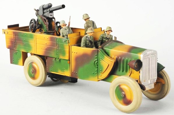Lineol Clockwork Tinplate FLAK AA Gun Truck.: Mechanism is working sluggishly. Electric lights have not been tested. One headlight is detached. Paint wear on the crew. Condition (Excellent Plus).
