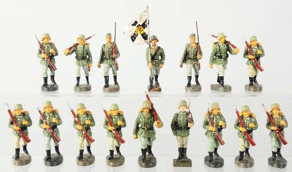 Elastolin German Army Marching Group.: Lot contains 14 German marchers, one flagman, and a standing Lineol. One marcher has wear. Condition (Very Good - Excellent).