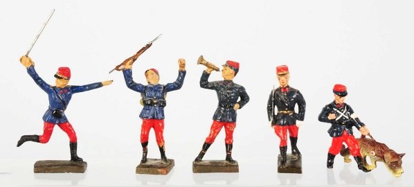Lineol French (Blue & Red) Toy Soldiers.: Lot of five includes four 7.5cm figures and one smaller dog handler. Some paint wear and cracking. Condition (Good).