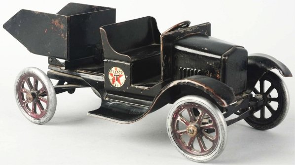 Pressed Steel Buddy L Flivver Dump Truck Toy.: American. Decals are almost completely worn off and someone has applied two "Texaco" decals on both sides of seat. Repainted wheels and repainted hood and grille. Condition (Good - Very Good). Size 12