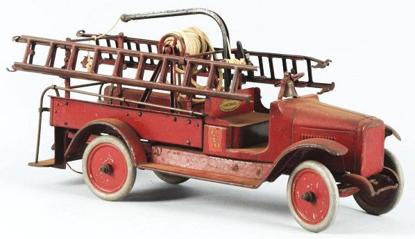 Pressed Steel Buddy L Ladder Fire Truck.: American. Original ladders and bell. Partial Buddy L decal on front and nice hardware store decal on top of seat. Some paint loss to ladders and fenders. Overall a nice, solid, original truck. May cle