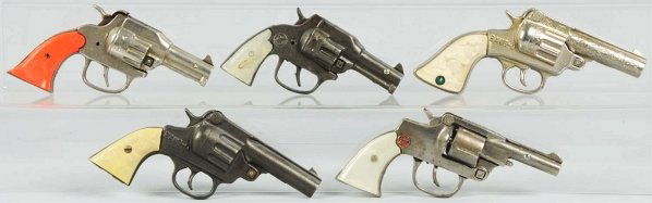 Lot of 5: Assorted Cap Guns.: Includes Hi-Ho, 6 Shooter and Bang-O. Both Bang-Os work great. Grips are slightly damaged to one and warped to other. The six shooter works very well. Condition (Very Good). Size Largest: 7 - 1/2" L.