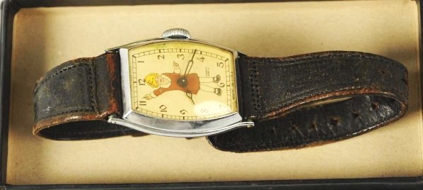 Little Orphan Annie Character Wrist Watch.: Circa 1935. Made by New Haven Watch Company. Working. Rectangular watch. Unusual rectangular box shows Orphan Annie, Sandy, and Daddy Warbucks. Box and watch band show some wear. Condition (Very Good)