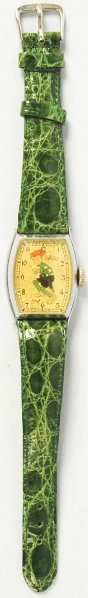 Smitty Character Wrist Watch.: 1939. Made by Ingersoll. Very scarce watch with rectangular case. Shows Smitty wearing cap and sweater with knickers. Watch is working. Some wear to face and replacement band. Condition (Good - Very G