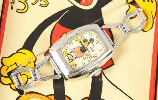 Rare Disney Mickey Mouse Character Wrist Watch.: 1937-1938. Made by Ingersoll. Working. Second hand with Mickey running. Metal link band. Watch is very clean. Includes scarce Fred Astaire box with insert and guarantee paper. Mickey is pictured on bo