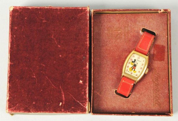Walt Disney Mickey Mouse Character Wrist Watch.: 1947. Made by Ingersoll/US Time. Working. Gold toned deluxe Mickey Mouse. Comes in hard-to-find maroon box, box insert, and guarantee sheet. Insert marked "Ingersoll" and "US Time" is faded. Condition