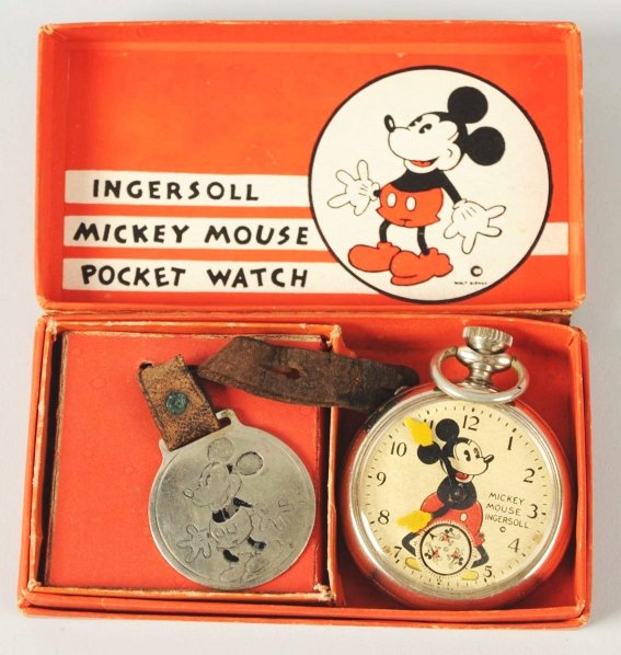 Walt Disney Mickey Mouse Character Pocket Watch.: Circa 1933. Made by Ingersoll. Watch is working and has three Mickey's that act as a second hand. Original leather band. Includes original box with insert and guarantee paper. Also includes embossed w
