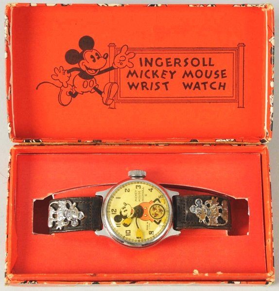 Walt Disney Mickey Mouse Character Wrist Watch.: 1933. Made by Ingersoll. Working. Has three running Mickey's that act as second hand. Leather band with silver Mickey emblems. Includes original critter box with replacement box insert. Yellowed cryst