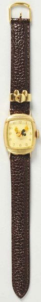 Walt Disney Mickey Mouse Character Wrist Watch.: Circa 1946. Made by Kelton. Back is marked "US Time". Plastic dial. First post-war Mickey Mouse wrist watch. Replaced leather band and some wear to watch. Condition (Very Good).