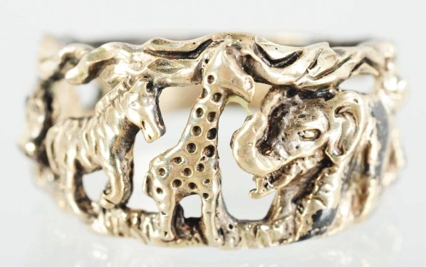 Clyde Beatty Jungle Ring.: 1940s. Sterling silver finish. Used to promote his appearance at the circus. Features a zebra, giraffe, elephant, tiger, and hippo. Condition (Near Mint).