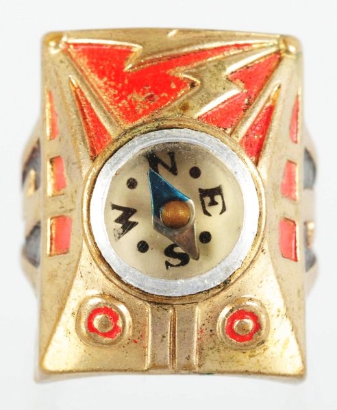 Captain Marvel Rocket Raider Compass Ring.: 1940s. Attributed to Captain Marvel. Great design with red and black paint highlights on gold base. Condition (Near Mint).