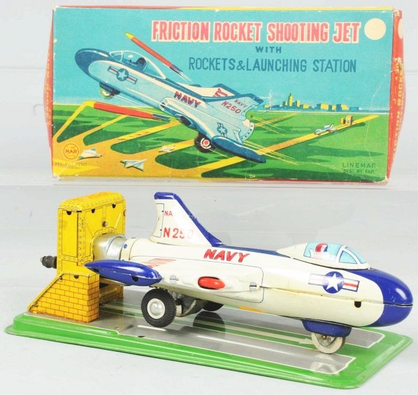 Tin Litho Rocket Shooting Jet Friction Toy.: Japanese. Working. Jet has one original rocket and launching station. Just minor scratching overall. Includes colorful original box marked "Linemar". Box has some tearing and creasing. Condition (Exce