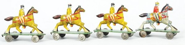 Lot of 4: Early Tin Litho Penny Toys.: Japanese. Pre-war. Scarce and unusual. Set includes three similar riders on horses that are on platforms and one rider on horse that is a different style. Toys hook together to form a train. Condition