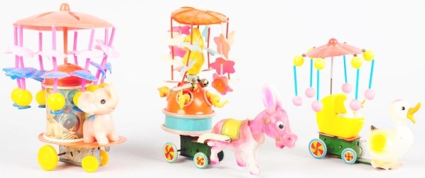 Lot of 3: Celluloid Animal Wind-Up Toys.: Japanese. Working. Includes one pulled by a donkey, one pulled by an elephant, and one pulled by a duck. All with celluloid whirligigs on top. Various conditions. Condition (Very Good). Size Largest: 