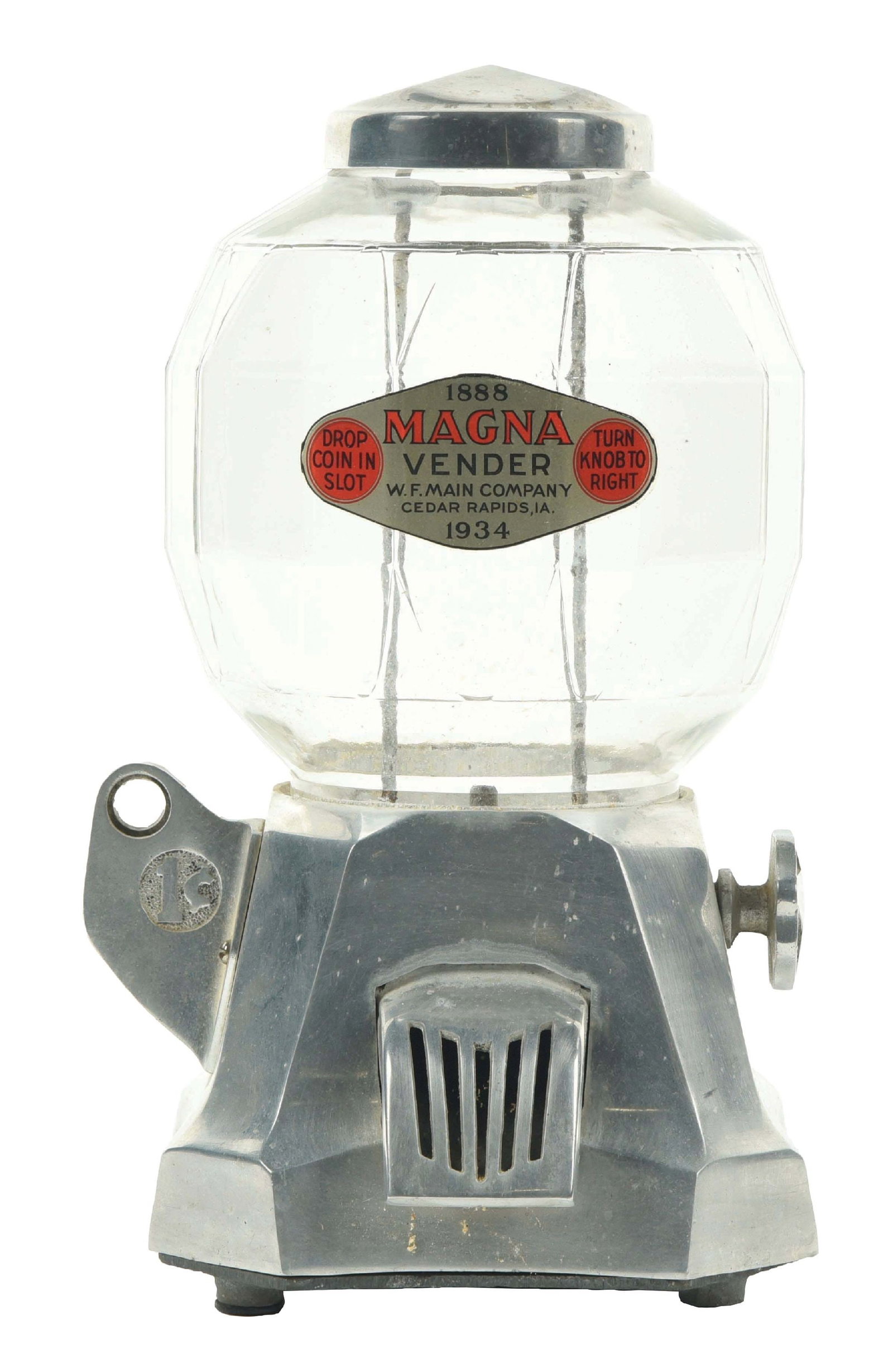1¢ MAGNA VENDOR PEANUT MACHINE: An aluminum peanut machine made by the W.F. Mane Co. out of Cedar Rapids, IA, called the "Magna Vendor." CONDITION: It shows the original patina to the aluminum body and multifaceted globe with the or