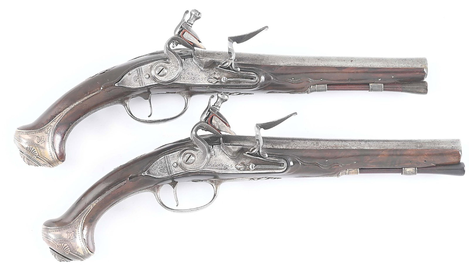 (A) PAIR OF SILVER MOUNTED FLINTLOCK OFFICER'S PISTOLS BY SEGALAS.: Israel Segalas was a French Huguenot born in 1714 who migrated to England and apprenticed to his father as a gunmaker. He was a freeman in 1745 and proofmaster from 1763-1772. This pair feature swampe
