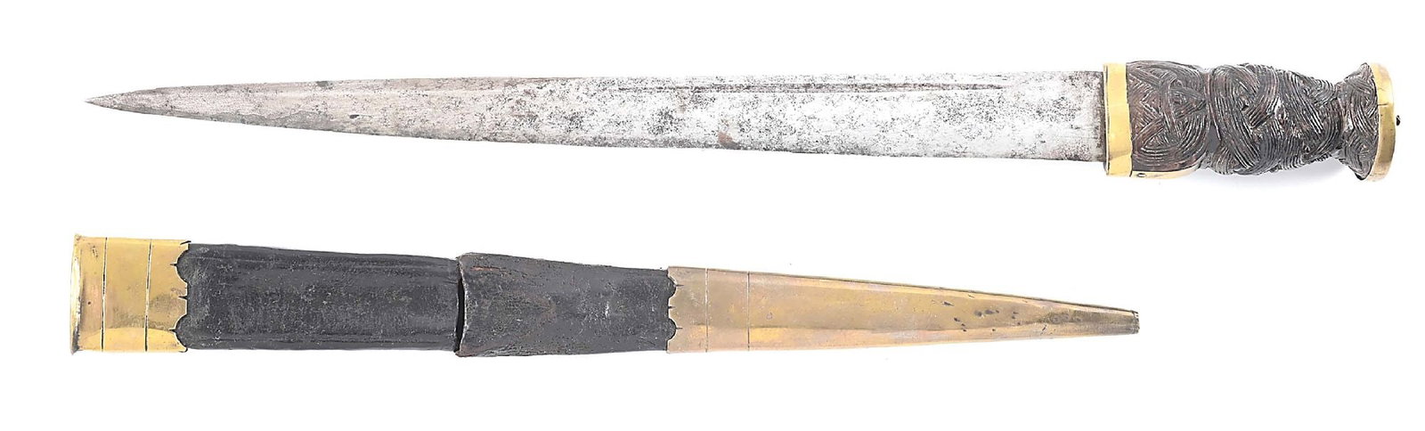 18TH CENTURY BRASS MOUNTED SCOTTISH DIRK WITH ORIGINAL SCABBARD.: Circa 1760-1780. For examples of similar form see plate 63 on page 67 and plate 66 on page 69 of "Scottish Swords and Dirks" by John Wallace. Straight tapered blade with deep short partial fullers and