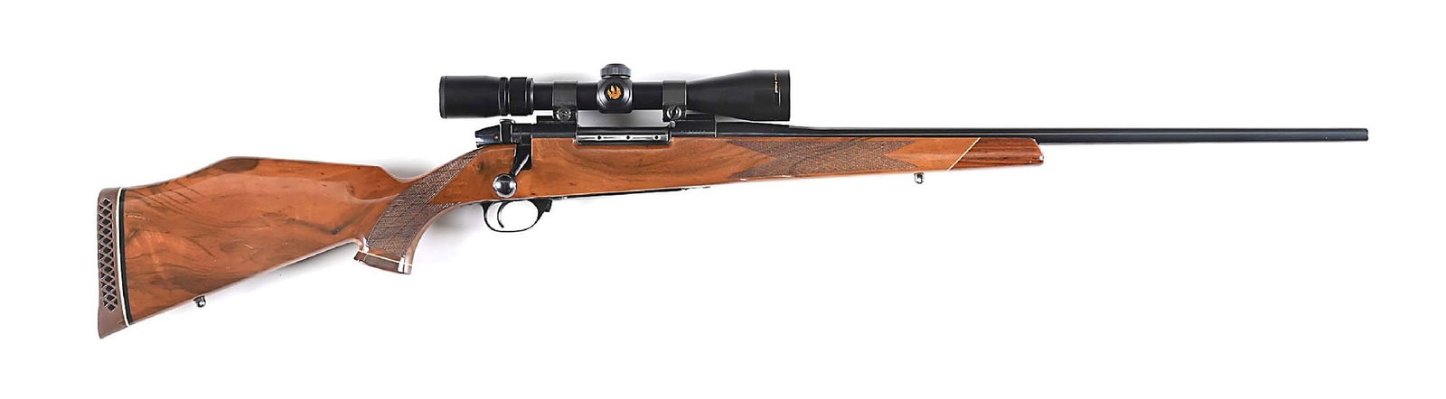 (M) WEATHERBY MARK V BOLT ACTION RIFLE IN .257 WEATHERBY MAGNUM.: Made in Japan circa 1984-85 with J.P. Sauer action. Features high polish blue finish, no barrel sights, fluted bolt and sporting a Nikon scope. Stock features Claro walnut with high gloss finish, Mont