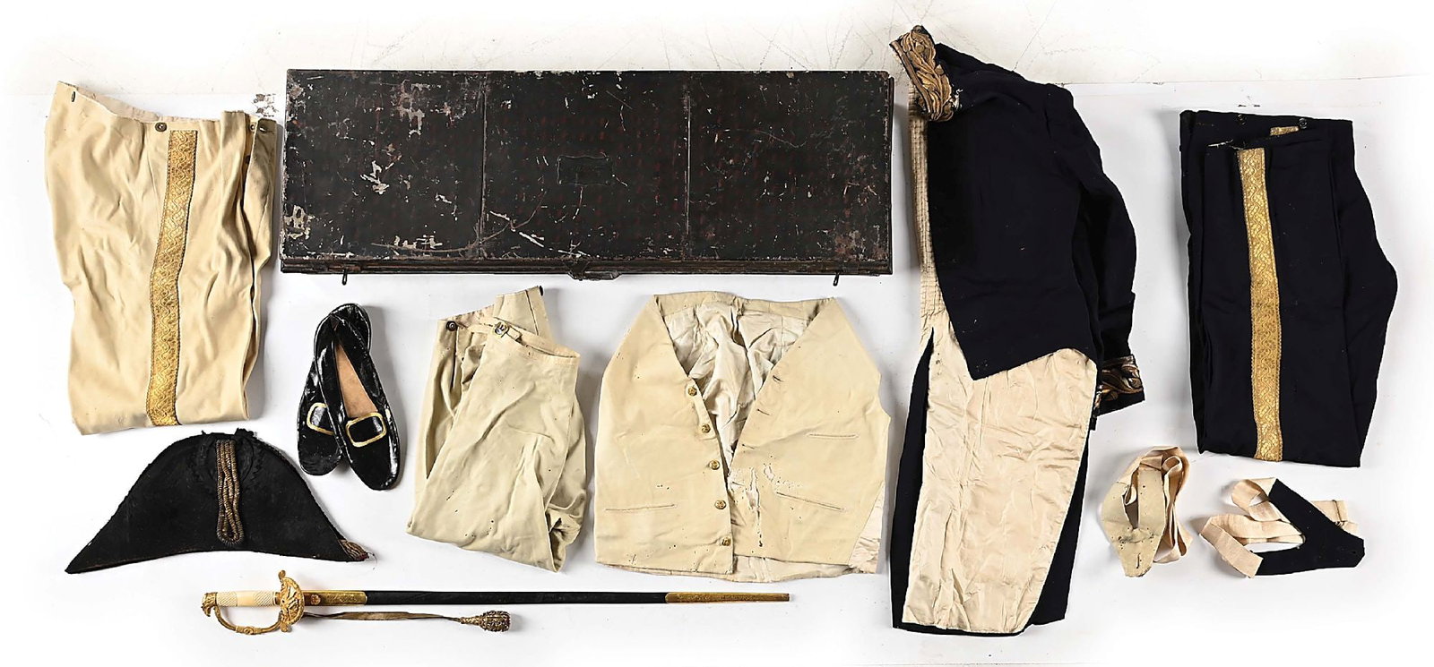 A COLLECTION OF ARTIFACTS BELONGING TO CHARLES L. WILSON INCLUDING HIS UNIFORM AND SWORD.: A cased American Diplomat uniform that belonged to Charles L. Wilson of Chicago. The group consists of his diplomat sword that features a blade embellished with patriotic motifs. Hilt is of gilt brass