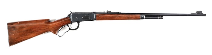 (C) WINCHESTER MODEL 64 LEVER ACTION RIFLE.