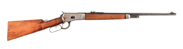 (C) 1ST YEAR WINCHESTER MODEL 53 LEVER ACTION TAKEDOWN RIFLE (1924).