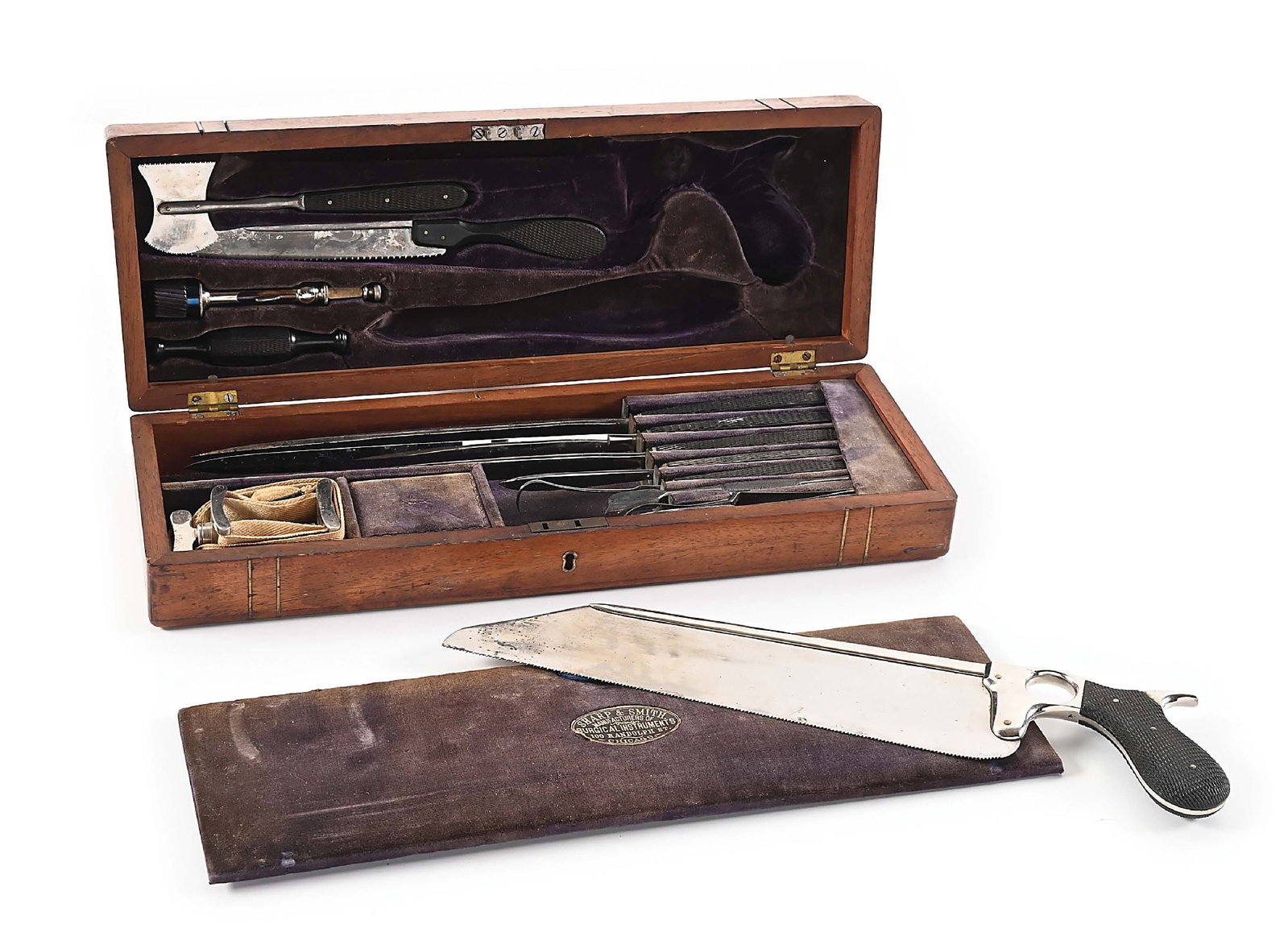 CA. 1880 IDENTIFIED MISSOURI CASED AMPUTATION SET BY SHARP & SMITH: Brass bound wood case with inset oval brass plate with roped script initials “Z. T. S.” over “Laclede / Mo.” Interior plush purple velvet lining with oval Sharp & Smith 100 Ran