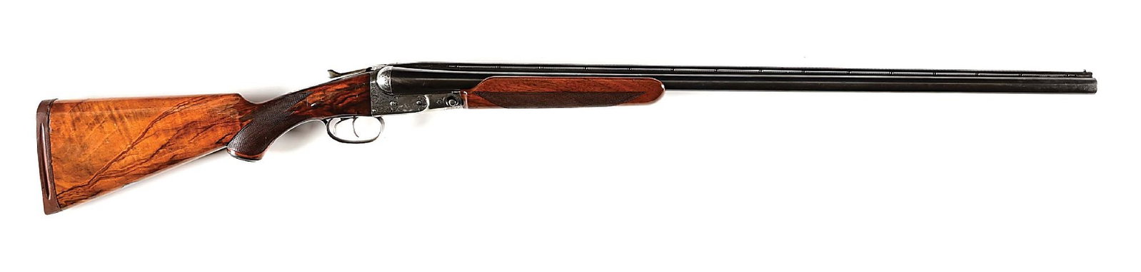 (C) PARKER BROS. DHE 12 GAUGE SIDE BY SIDE SHOTGUN.: Manufactured in 1913. Water table listed as number 3 (DH) with ejectors (E). The book lists this gun with an engraved case color hammerless box lock, Titanic steel barrels, and a checkered pistol grip