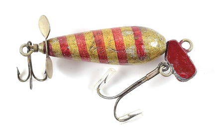 SPRINGFIELD NOVELTY REEL LURE IN GOLD WITH RED STRIPE