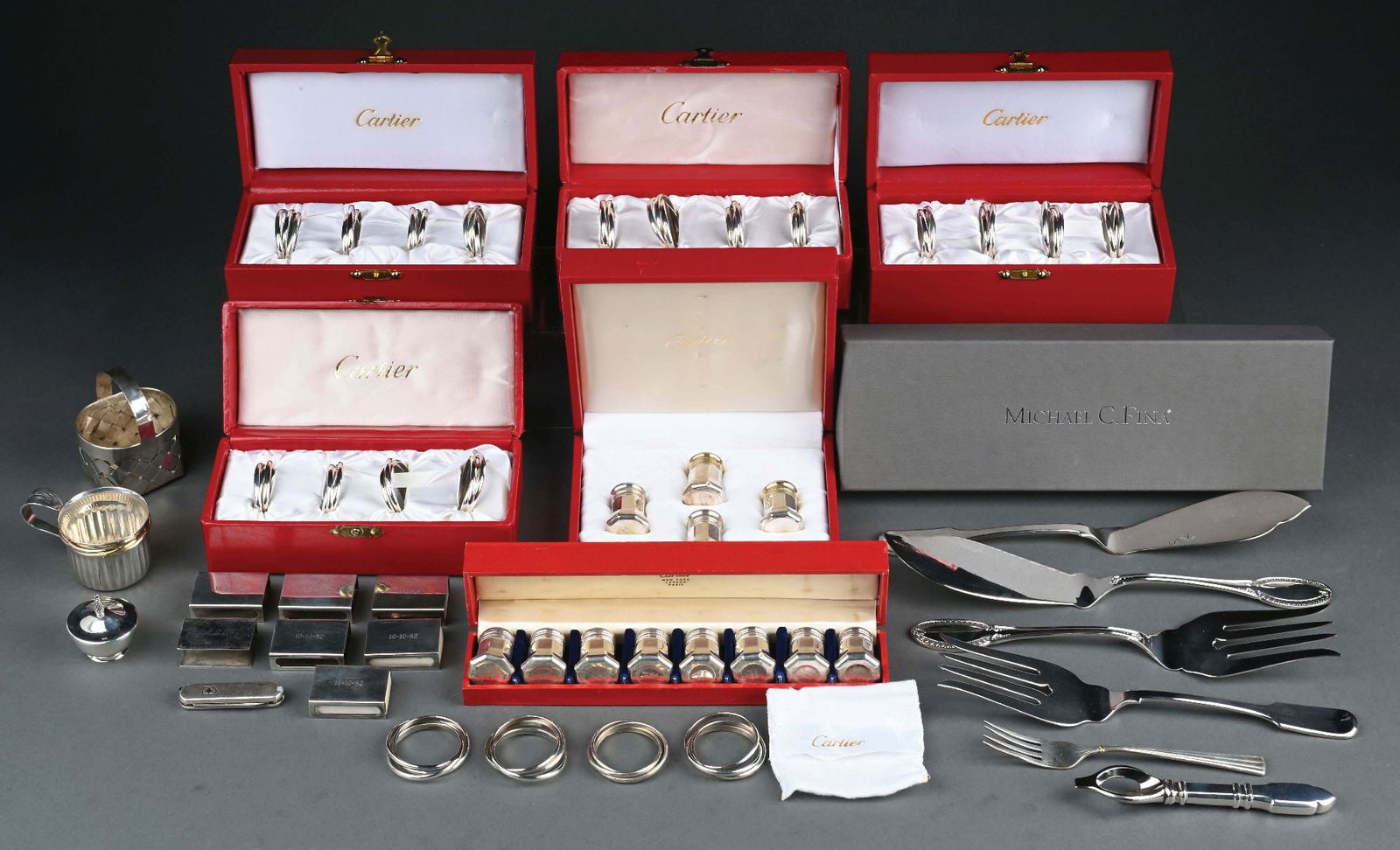 A GROUP OF BOXED CARTIER STERLING NAPKIN RINGS (1 of 5)
