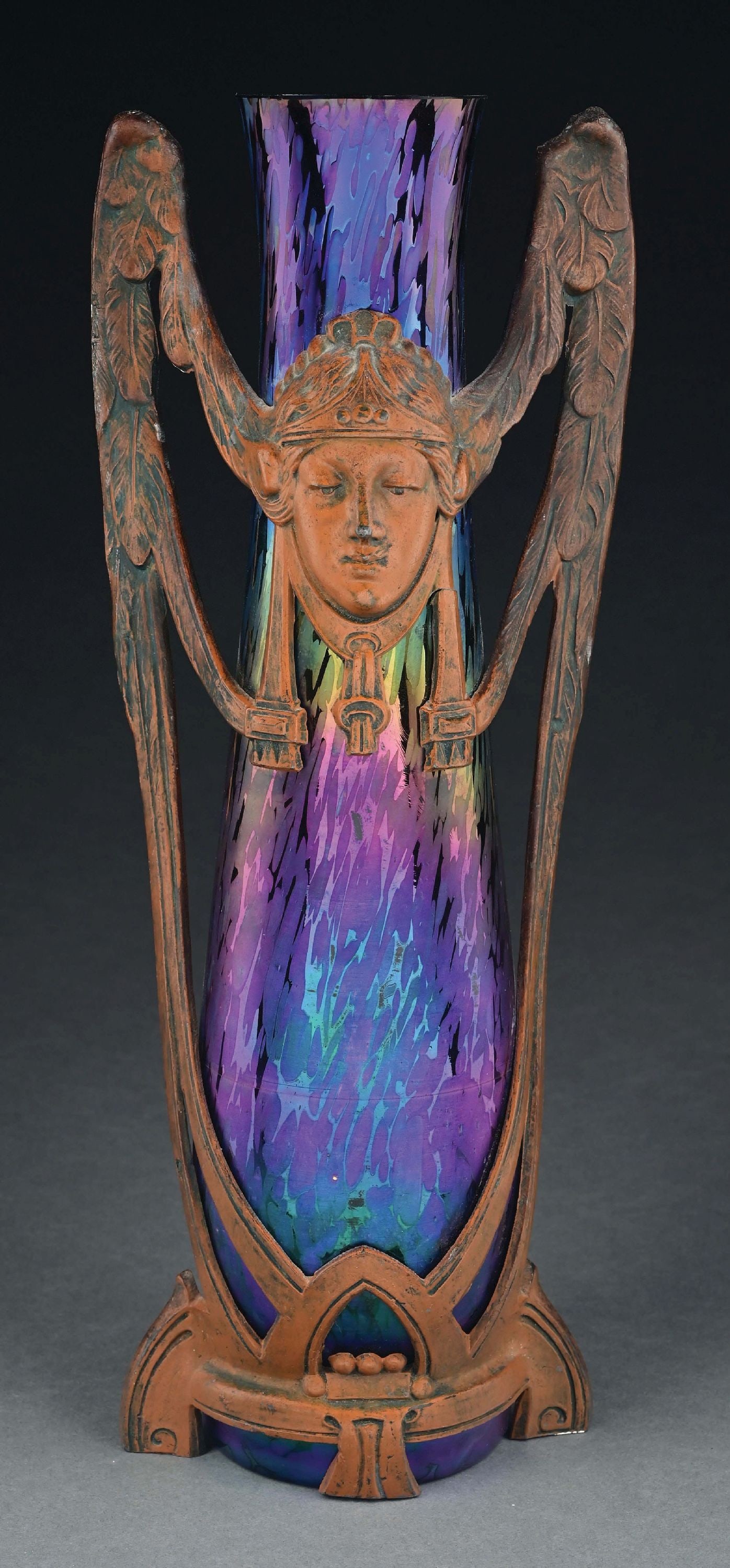 LOETZ ART NOUVEAU GLASS VASE W/ BRONZE ORMOLU: A beautiful glass and bronze art nouveau vase by Loetz. The 14" tall vase is composed of gorgeous purple iridescent glass with an oil spot pattern. It is mounted in a art nouveau bronze ormolu with fa