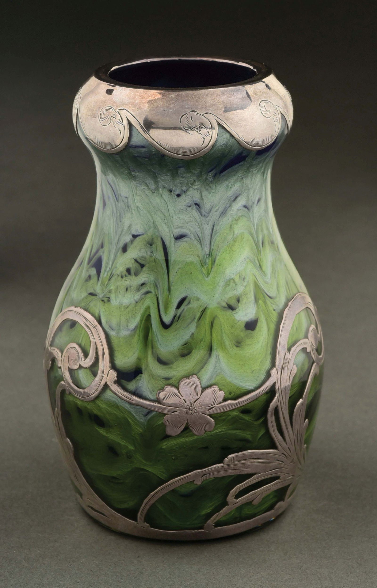 LOETZ COBALT BLUE AND GREEN TITANIA GLASS VASE W/ SILVER OVERLAY, C. 1902: Beautiful loetz green titania glass. Deep color. Nice silvering. Condition: (Excellent) Dimensions: 3" D. x 5" T.