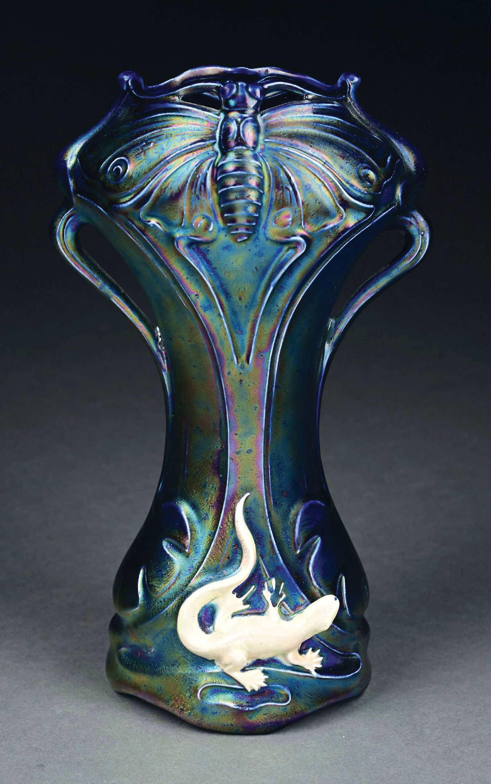 HELIOSINE 2-HANDLED VASE W/ BUTTERFLIES & LIZARDS: Strong blue and cream iridized glazes. Condition: (Mint) Dimensions: 6" x 4" x 10 - 3/8".